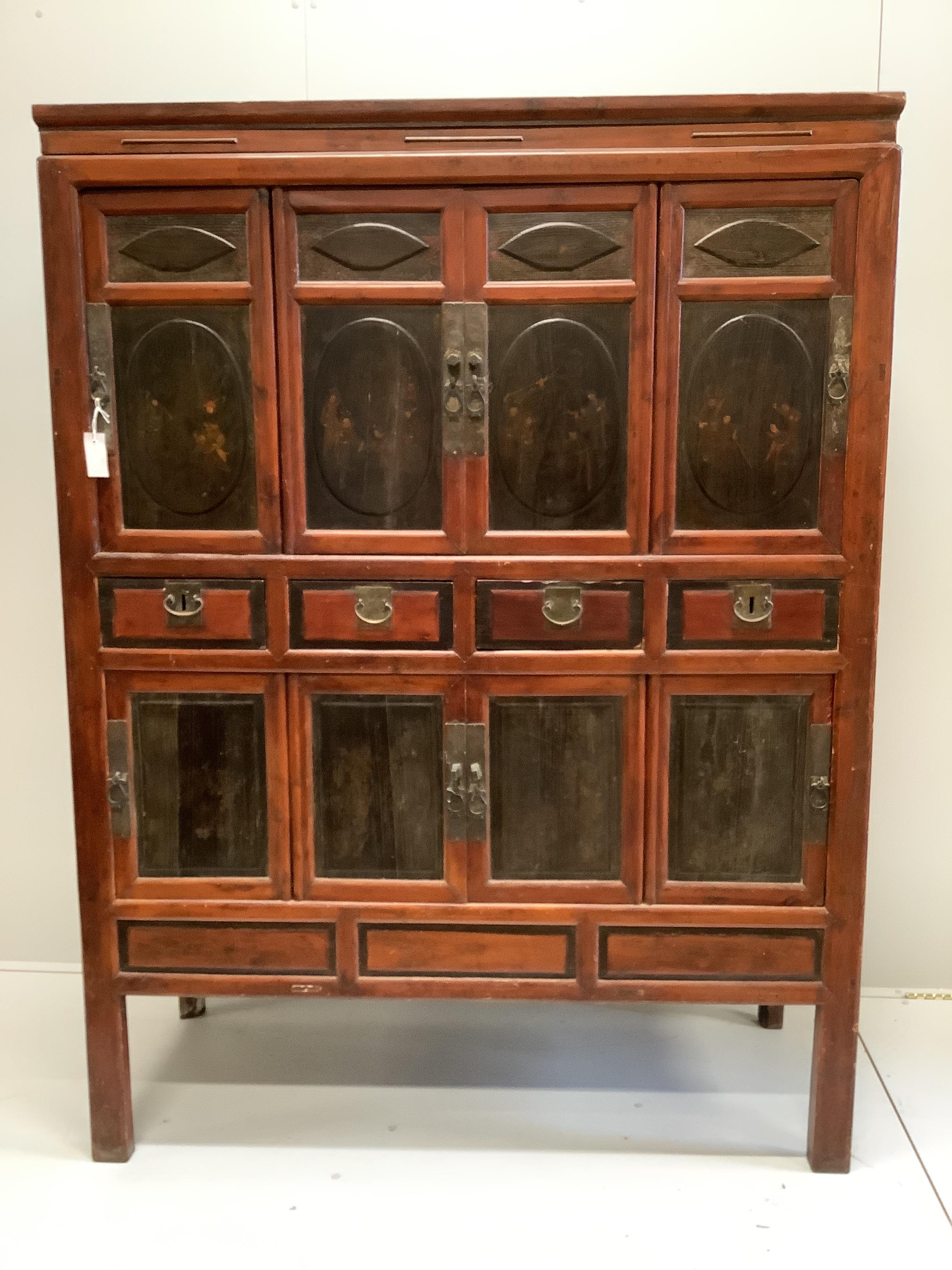 A Chinese lacquered pine side cabinet, width 134cm, depth 55cm, height 180cm
